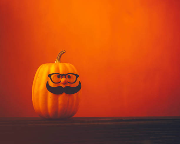 istock Cute pumpkin halloween characters on bright orange background 852442586