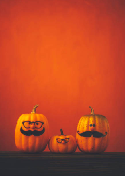 istock Cute pumpkin halloween characters on bright orange background 852442588