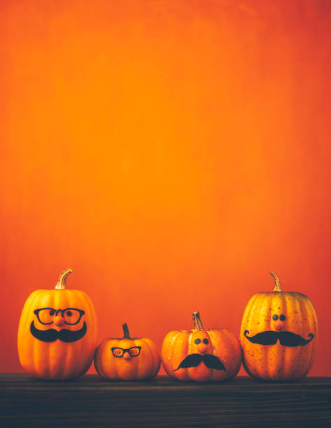 istock Cute pumpkin halloween characters on bright orange background 852442634