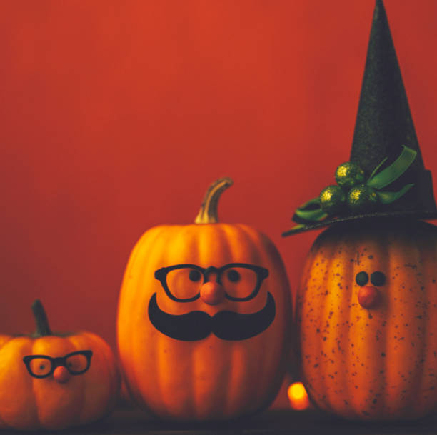 istock Cute pumpkin halloween characters on bright orange background 852442654