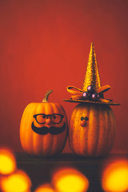 istock Cute pumpkin halloween characters on bright orange background 852442658