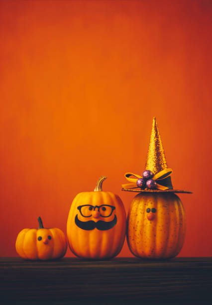 istock Cute pumpkin halloween characters on bright orange background 852442684