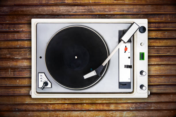 istock The old Soviet vinyl player isolated on wooden background. 852443294