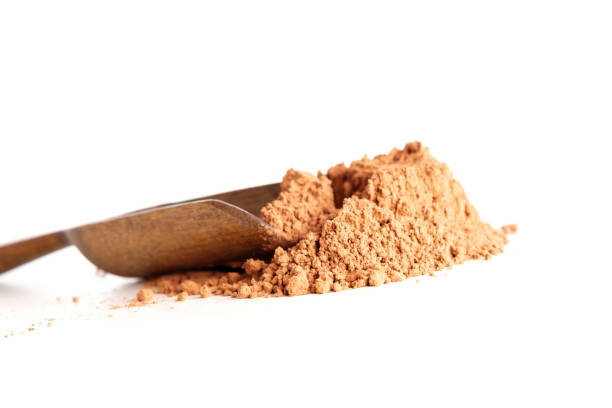 istock Cocoa powder in a wooden spoon 852453908