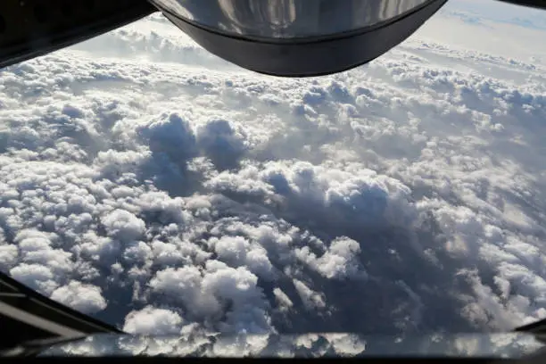 Flying with KC-135 Stratotanker over the clouds during Mid-air Refueling