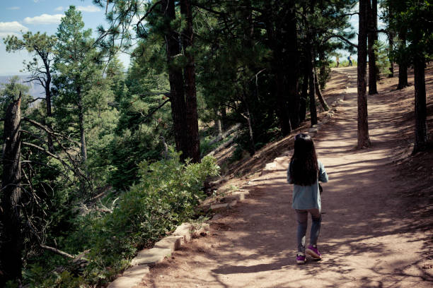 istock Girl Walking on Foot Path in Nature 852460518
