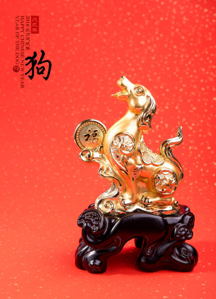 istock golden dog statue on red paper 852466552
