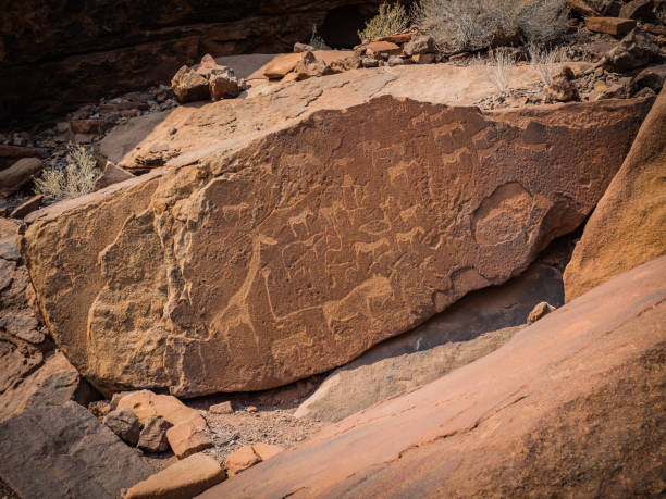 istock Twyfelfontein Unesco World Heritage site, petroglyphs in red sandstone 852467322