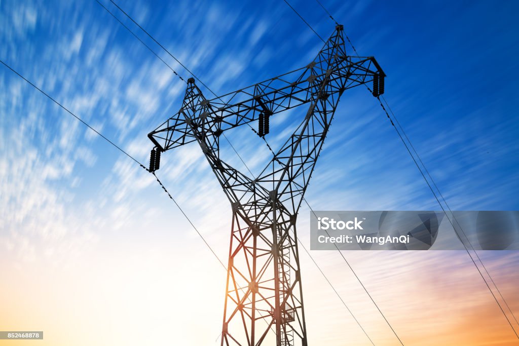 high voltage post.High-voltage tower sky background. Communications Tower Stock Photo