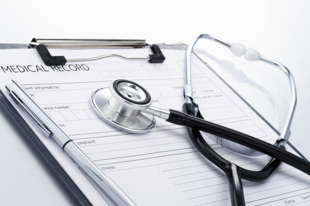 istock Stethoscope and medical record on reflection background. 852474462