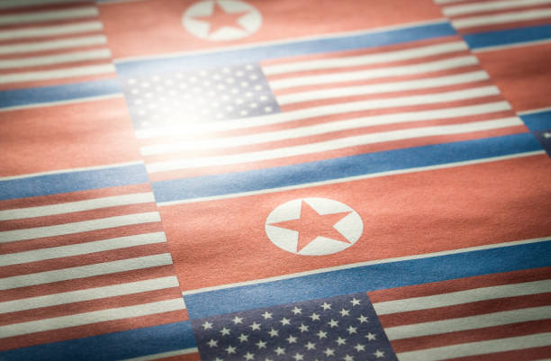 the flag of north korea and united states of america (usa) on a wrinkled rough paper texture. - north korea hydrogen bomb korea missile imagens e fotografias de stock