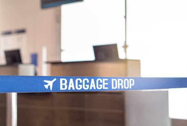 istock Baggage drop at airport. Luggage desk in terminal. 852475720