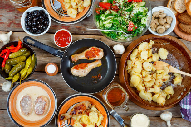 istock various Traditional American snacks with grilled chicken legs and fried potatoes on the dining table. View from above. Concept of eating outdoors on a day off. 852481342