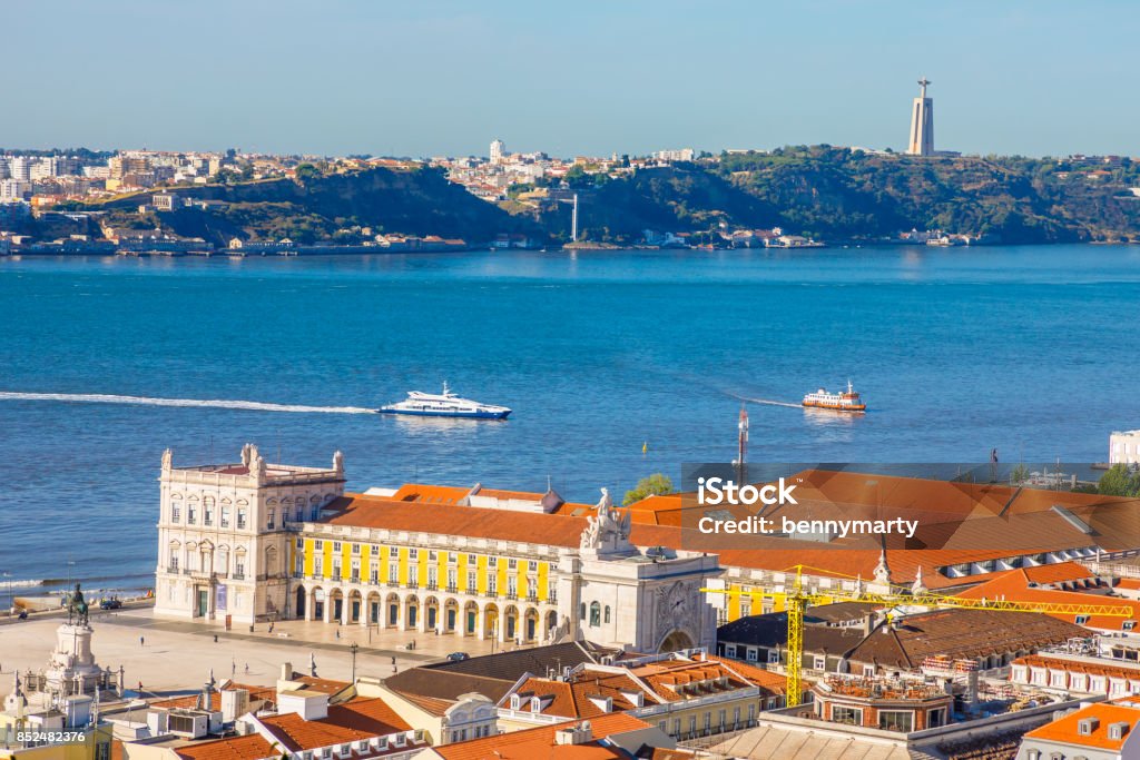 Lisbon Tagus River skyline Lisbon aerial view from Sao Jorge Castle, Portugal, Europe. Close up of Cristo Rei in Almada, Tagus River and Comercio or Commerce Square with Rua Augusta Triumphal Arch on background. Urban skyline. Castel Gandolfo Stock Photo