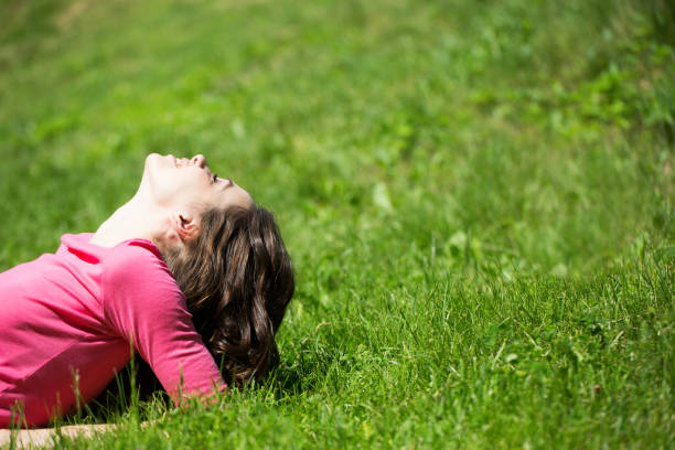 istock Beautiful happy woman on green grass. 852482390