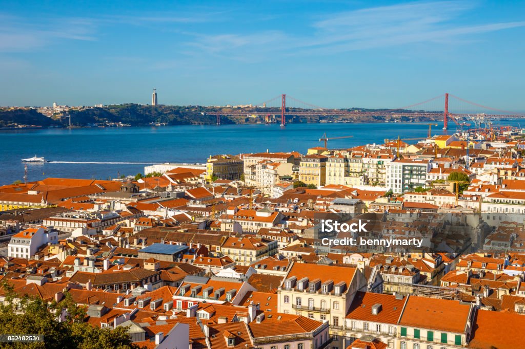 Lisbon skyline Portugal Lisbon aerial view from popular Sao Jorge Castle, Portugal, Europe. Bridge of 25 April, Cristo Rei, Alfama District and Tagus River on background. Panoramic view over center of Lisbon in a sunny day Lisbon Stock Photo