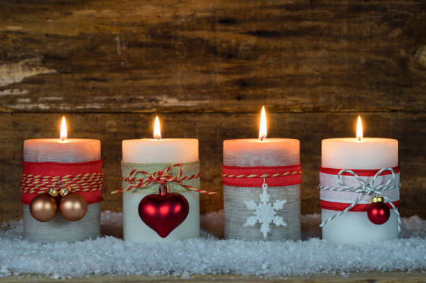 istock Festive burning Christmas candles with ornaments 852485840