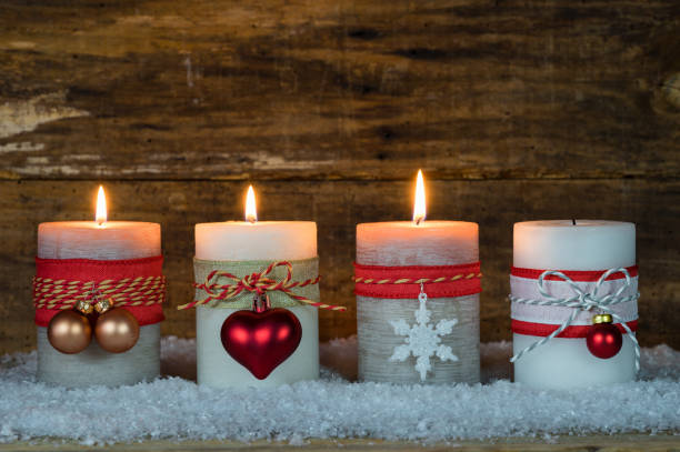 istock Festive burning Christmas candles with ornaments 852485892
