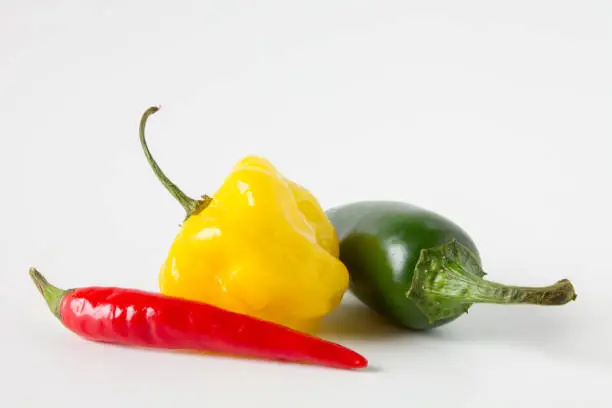 Yellow Habanero, red Rawit and green Jalapeno chili pepper isolated on white background