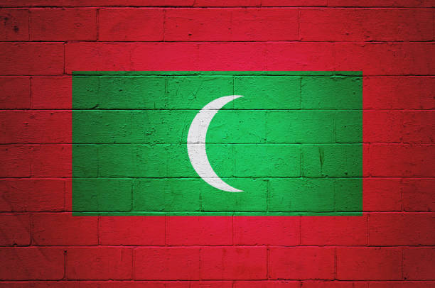 Flag of the Maldives painted on a brick wall.