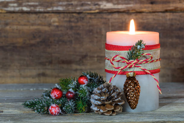 istock Christmas candle with natural decoration 852493900