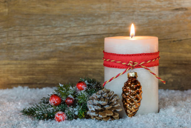 istock Christmas candle with decoration on snow 852498764