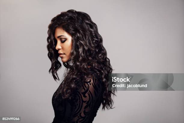 Attractive Young Woman With Curly Hair Stock Photo - Download Image Now - Fashion Model, Women, One Woman Only