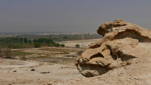 Rocks, overlooking oasis city sector stock photo