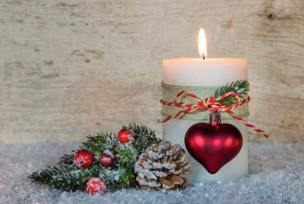 istock Ornated burning Christmas candle with decor 852502130