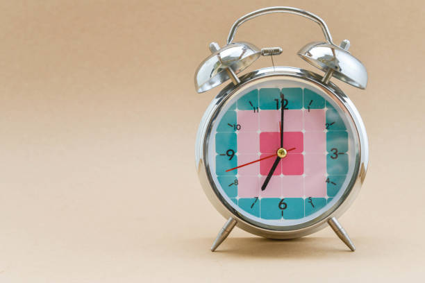 istock Alarm clock is showing time for 7 AM 852504590