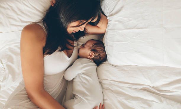 istock Mother and son sleeping together on bed 852508570