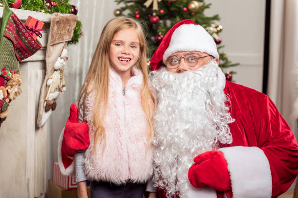 istock Merry child celebrating Christmas with Santa 852511986