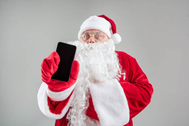 istock Senior Father Frost presenting modern cellphone 852520536