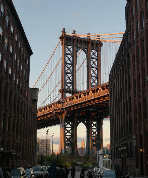 istock Brooklyn bridge with Empire State Building at sunset 852542658