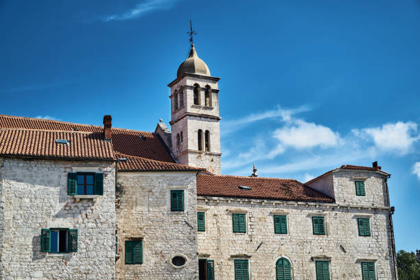 istock stone houses and church bell tower 852547258