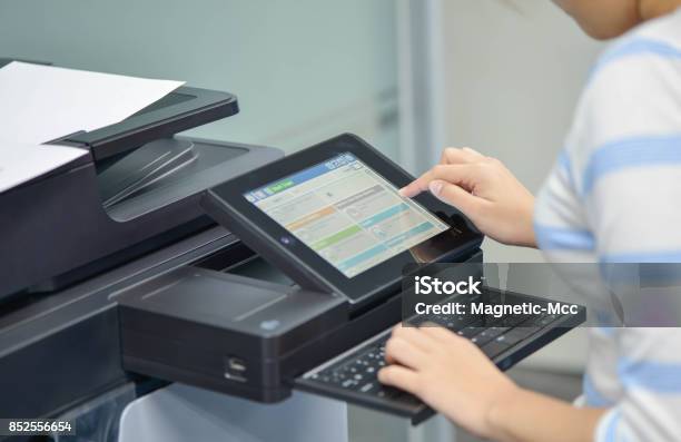 Business Woman Is Using The Printer To Scanning And Printing Document Stock Photo - Download Image Now