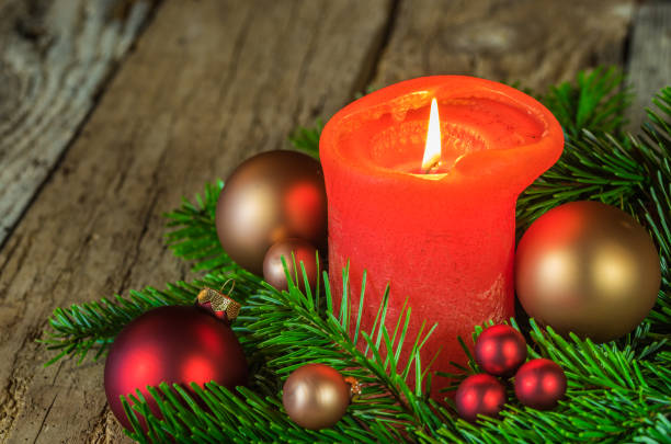 istock Christmas decoration with red burning candle 852565962