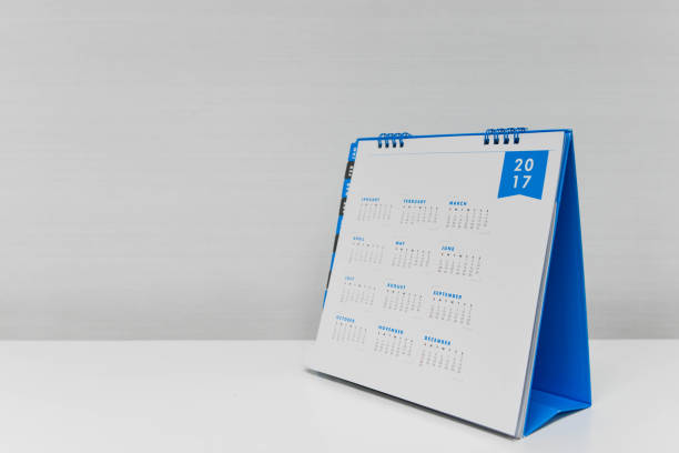 istock White calendar of year 2017 on the white table 852574898