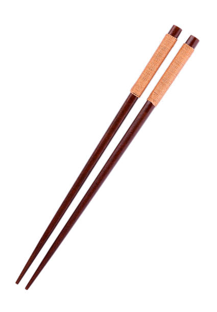 istock Wooden pairs of chopsticks on white background 852575324