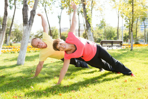 istock Happy elderly seniors couple exercising in park 852590596