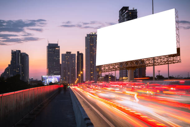 istock Blank billboard on light trails, street and urban in the night - can advertisement for display or montage product or business. 852600534
