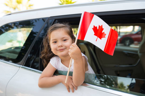 istock Girl Holding Canadian Flag 852612540