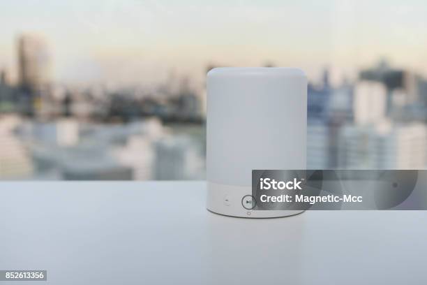 Wireless Speaker On The White Table Stock Photo - Download Image Now - Speaker, Bluetooth, Portability