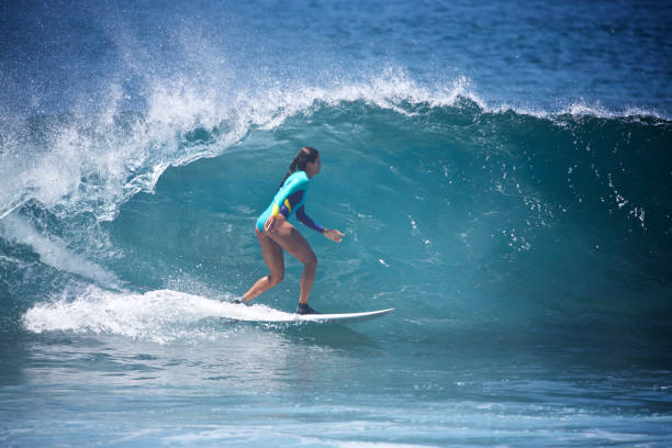 istock Surfer Girl on a beautiful small wave 852620314