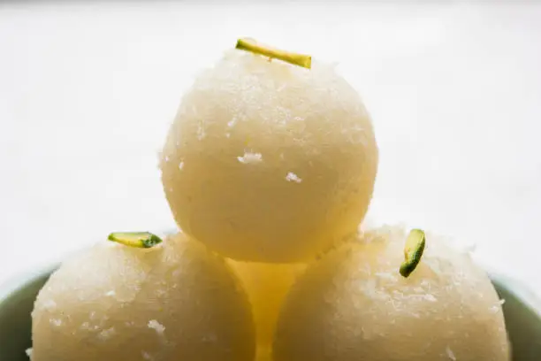 Stock Photo of Rasgulla or sponge Ras Gulla, It is made from ball shaped dumplings of chhena and semolina dough, cooked in light syrup made of sugar.