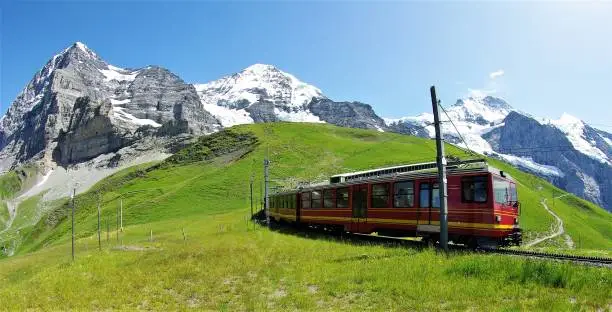 A spectacular series of 9 images depicting the awesome environment in which Swiss Mountain Railways are built. All taken on clear, bright summer days, the harsh and unforgiving gradients and physical geography challenges posed to civil engineers who construct such systems are vividly illustrated. The uniquely beautiful region of the Bernese Oberland with the three famous peaks of the Eiger, Monch and Jungfrau are featured in this series based around the Jungfraubahn, the Wengernalpbahn and the Schynigge Platte Bahn.