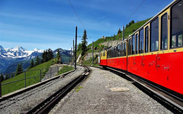 The Uniquely Spectacular Mountain Railways of the Jungfrau Region in the Bernese Alps, Switzerland A spectacular series of 9 images depicting the awesome environment in which Swiss Mountain Railways are built. All taken on clear, bright summer days, the harsh and unforgiving gradients and physical geography challenges posed to civil engineers who construct such systems are vividly illustrated. The uniquely beautiful region of the Bernese Oberland with the three famous peaks of the Eiger, Monch and Jungfrau are featured in this series based around the Jungfraubahn, the Wengernalpbahn and the Schynigge Platte Bahn. jungfrau stock pictures, royalty-free photos & images