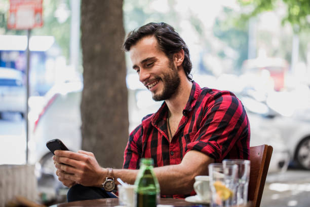 istock Sitting at the cafe and texting 852663818