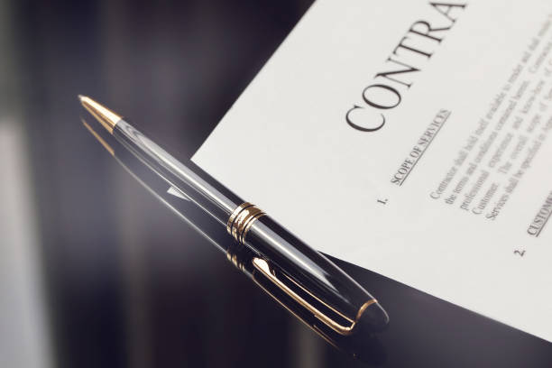 contract documents and fountain pen on black desk, business concepts - fountain pen business pen writing imagens e fotografias de stock