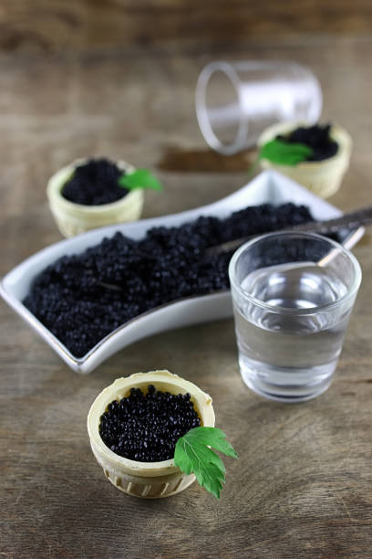 istock black caviar on a wooden background 852674246